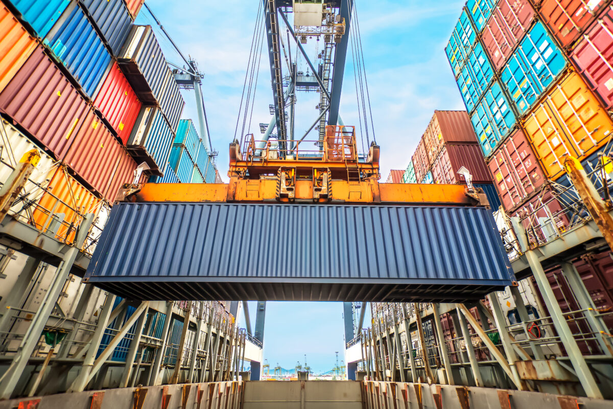 ContainerLoadingInACargoFreightShipWithIndustrialCrane