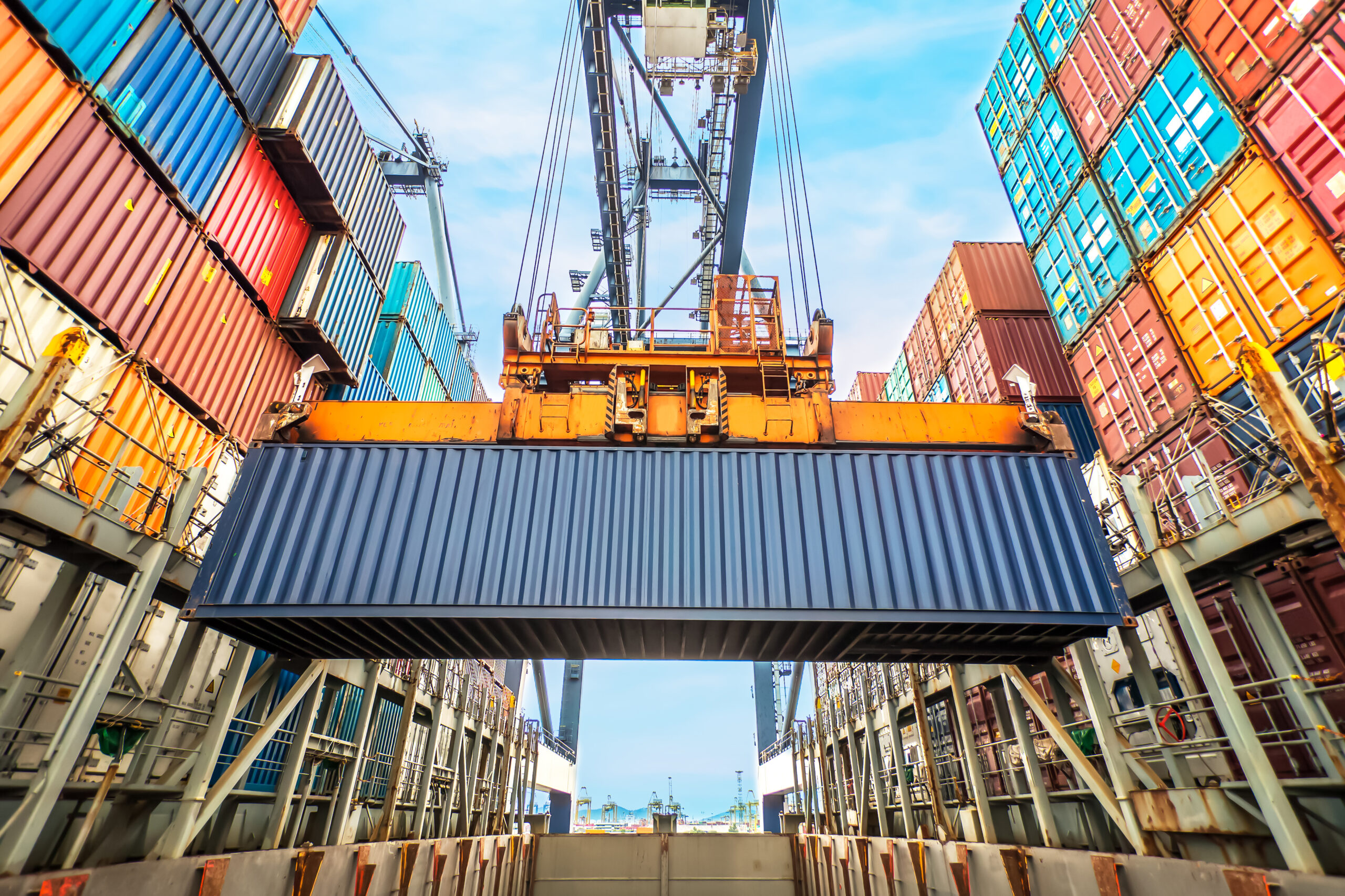ContainerLoadingInACargoFreightShipWithIndustrialCrane