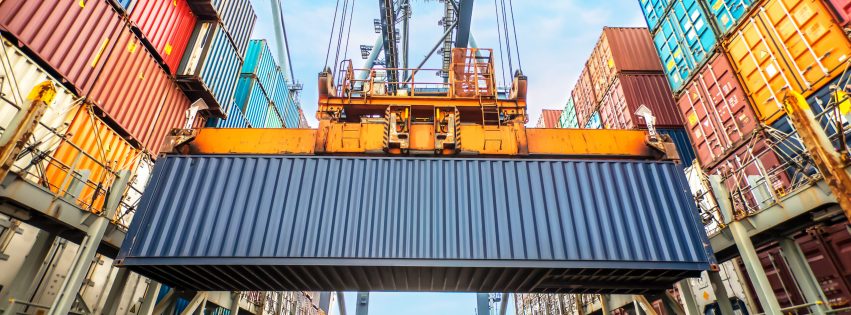 ContainerLoadingInACargoFreightShipWithIndustrialCrane